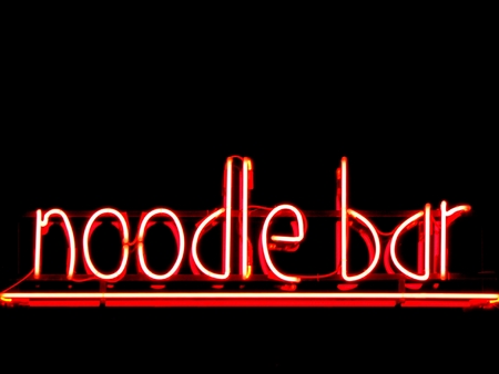 Noodle bar neon sign outside restaurantの写真素材