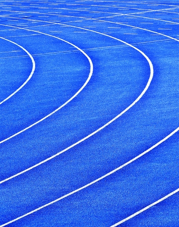 blue curvy running  lanes on stadiumの写真素材