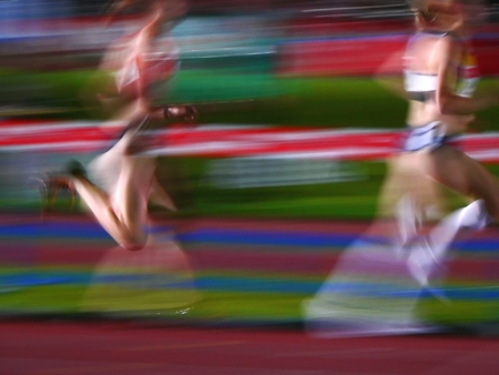two athletes women running motion blurの写真素材