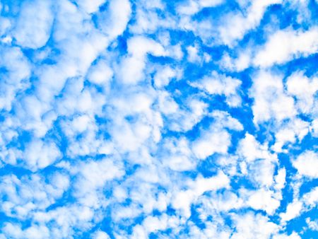 Fluffy clouds on blue sky also called altocumulus