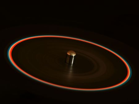 Spinning vinyl disc with blue and red labelの写真素材