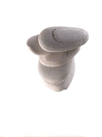 Balanced beach stones from top isolated on whiteの写真素材