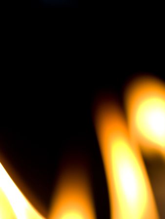 Background made of candles flames on black