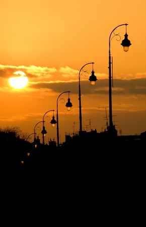 Lamp post at sunset of the Pont Neuf bridge in Toulouse Franceの写真素材