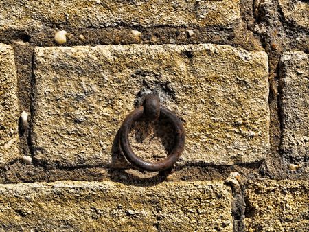 Details of a old wall with an iron ringの写真素材