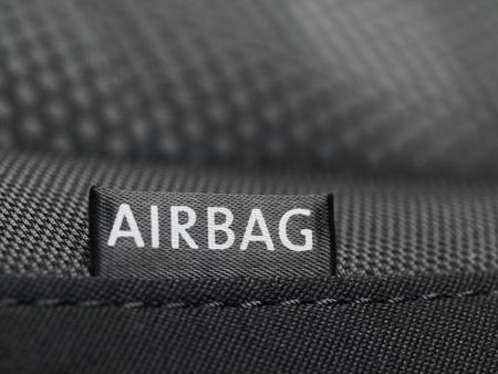 Detail of an airbag label on the side of a car seat