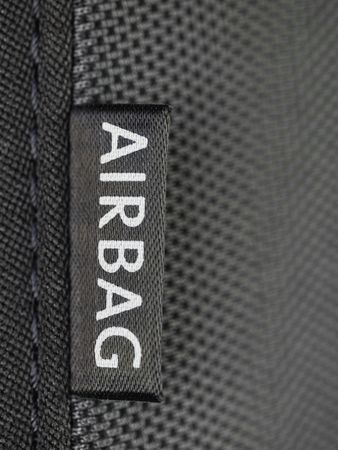 Detail of an airbag label on the side of a car seat の写真素材