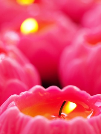 Wish pink candles during offering in a chinese temple in Malaysiaの写真素材