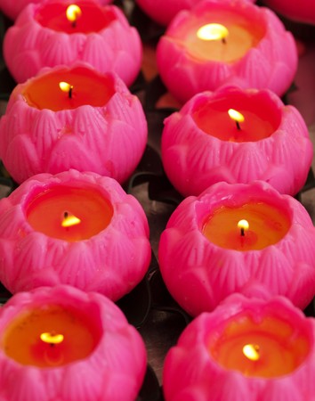Wish pink candles during offering in a Chinese temple in Malaysiaの写真素材