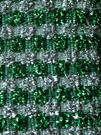 Macro picture of a green metallic scrub sponge