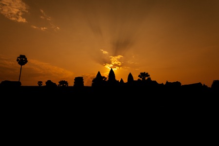 Beautiful sunrise at Angkor Wat   with sun behind temple