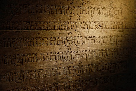 Sanskrit writing carved in sandstone in Angkor templeの写真素材