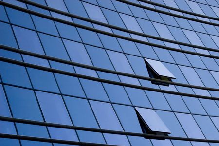modern office building glass wall and two windows