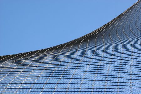 part of wire web against blue skyの写真素材