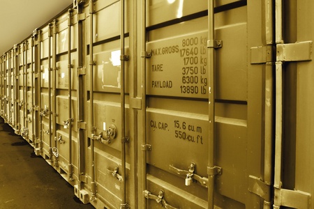 A pile of  containers used for industrial transportation.