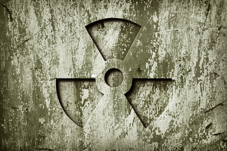 A nuclear sign on grunge  metal door.の写真素材