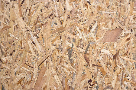 Recycled and compressed wood chippings board texture.