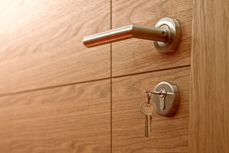 Close-up of the lock with  key on a door. の写真素材