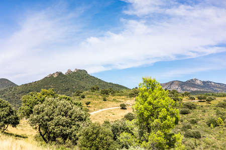 View of the Roc des Deux Vierges in Saint-Saturnin-de-Lucian (Occitanie, France)の写真素材