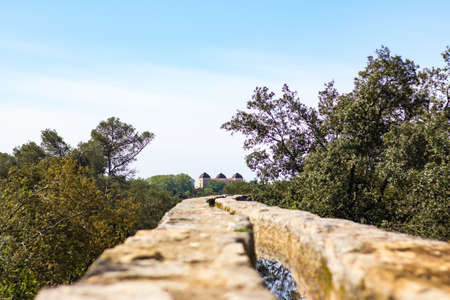 Old stone bridge over the river in the villageの写真素材