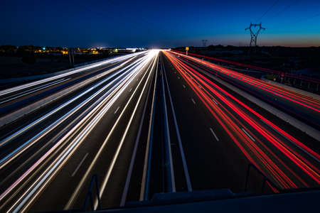 A9 and A709 motorways between NÃ®mes and Montpellier at night in long exposure (light trails)の写真素材