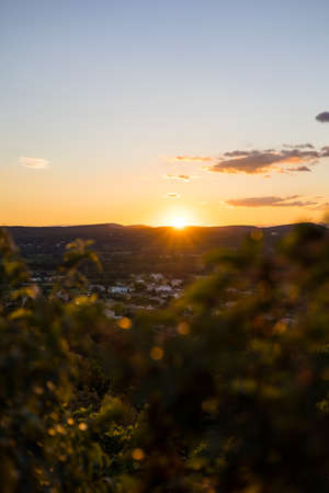 Sunset over the countryside around the medieval village of VÃ©nÃ©jan (Occitanie, France)