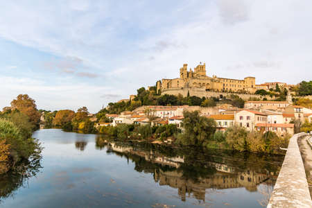 View from the banks of the Orb River on the Saint-Nazaire cathedral in BÃ©ziers at sunset (Occitanie, France)のeditorial素材