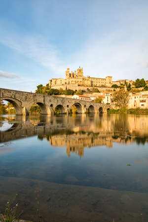 View from the banks of the Orb River on the Saint-Nazaire cathedral in BÃ©ziers at sunset (Occitanie, France)のeditorial素材