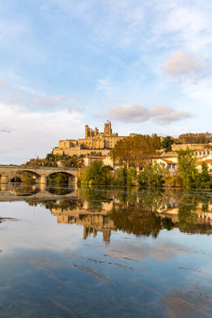 View from the banks of the Orb River on the Saint-Nazaire cathedral in BÃ©ziers at sunset (Occitanie, France)のeditorial素材
