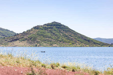 Landscape of the lake and mountains on a sunny summer day.