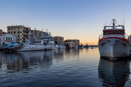 Fishing boats along the Royal Canal of SÃ¨te at sunset (Occitanie, France)のeditorial素材