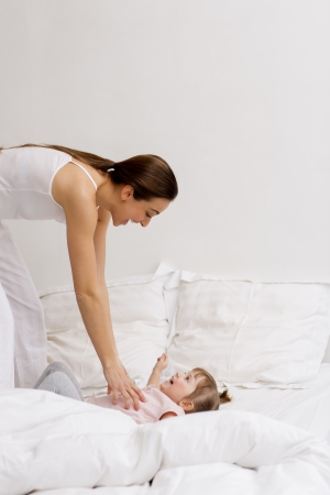 Portrait of a family at home in bedroomの写真素材