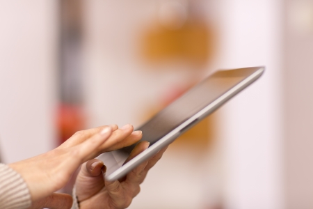 Female holding digital tablet, closeupの写真素材