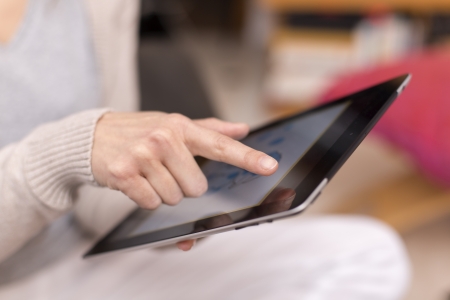Female holding digital tablet, closeupの写真素材