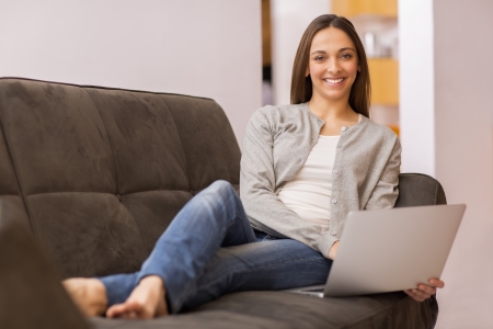 Smiling female teleworking at homeの写真素材