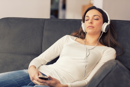 Portrait of sleeping female whit her headphonesの写真素材