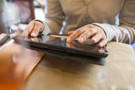 Female digital tablet computer bar restaurant