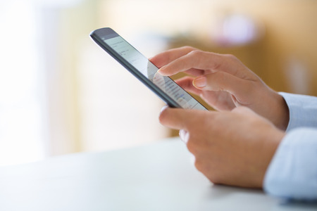Woman using mobile phone, message sms emailの写真素材