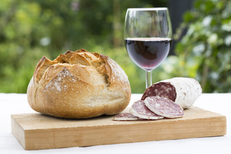 Slices of salami on natural woodenの写真素材