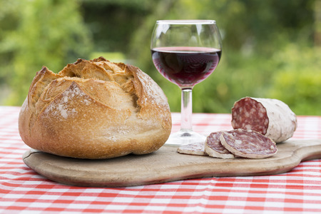 Slices of salami on natural woodenの写真素材