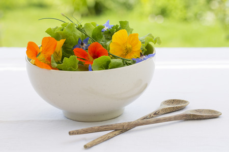 Summer fresh flowors salad in bowlの写真素材