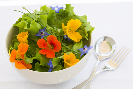Summer fresh flowors salad in bowlの写真素材