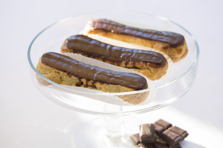 Delicious French Chocolate eclairs on plateの写真素材