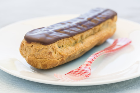 Delicious French Chocolate eclairs on plateの写真素材