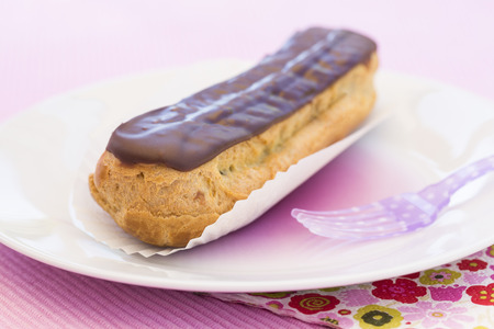 Delicious French Chocolate eclairs on plateの写真素材