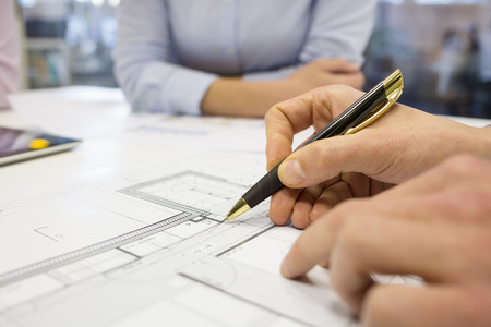 Business team desk architect man woman digital tablet blueprint constructionの写真素材