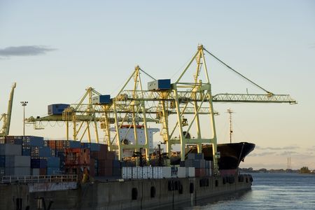 Container cranes loading a ship in a major portの写真素材