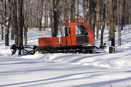 Snowplough (snowplow) waiting for the storm in the park