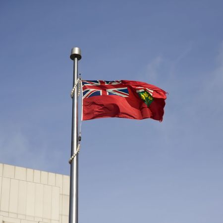Ontario flag on a clear blue skyの写真素材