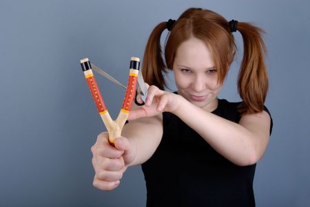 Redhead young beautiful woman with pigtail and tweakerの写真素材